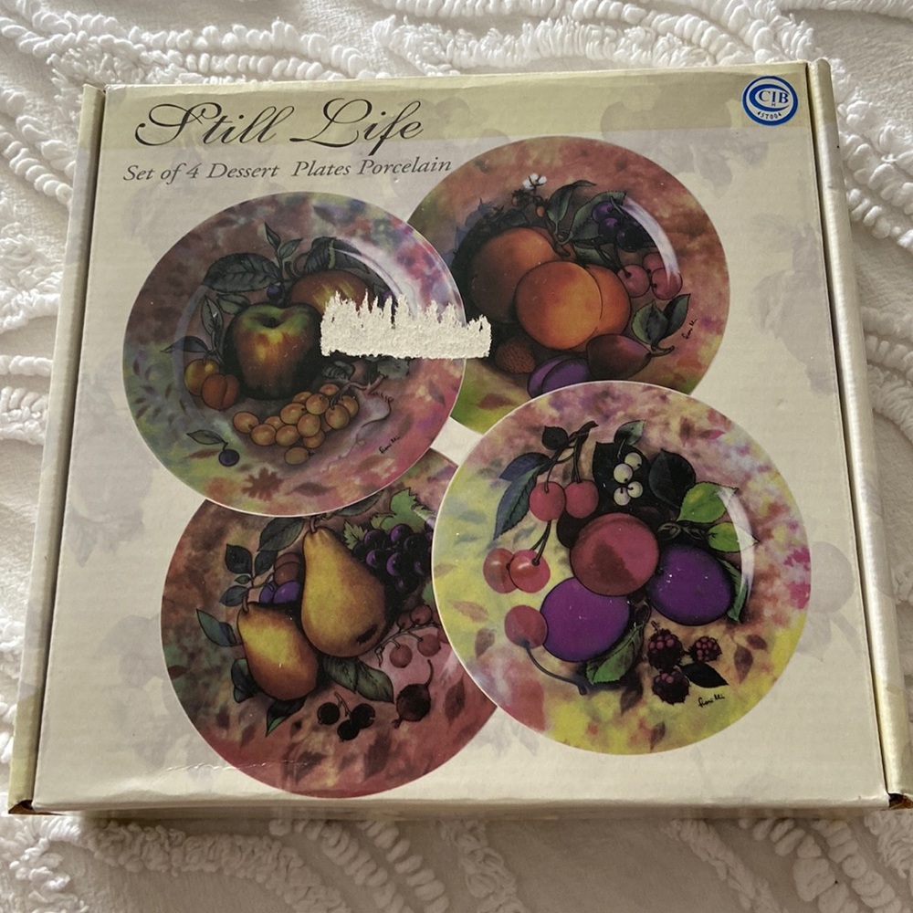 Never used. Still Life set of 4 dessert plates